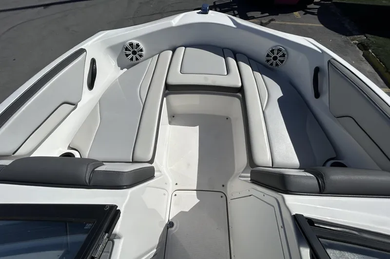 Slide: The Image of 2019 Yamaha Boats SX190 interior with white seating and speakers. - 14