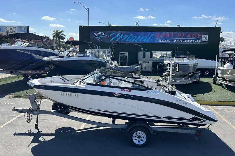 Slide: The Image of 2019 Yamaha Boats SX190 on trailer at Miami Boat Place dealership. - 19