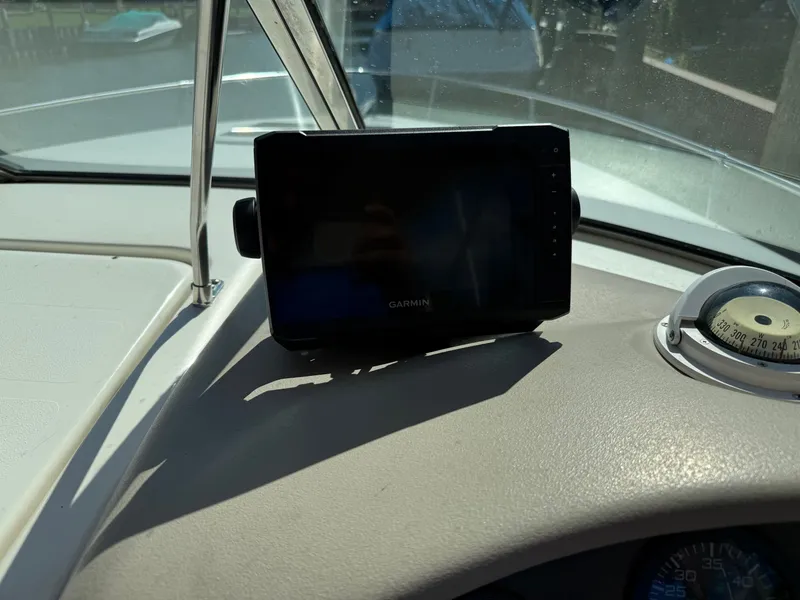 Slide: The Image of Dashboard of a 1996 Sea Ray 280 Sun Sport with Garmin GPS and compass. - 12