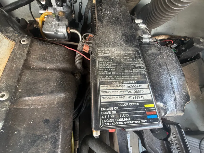 Slide: The Image of Engine compartment of a 1996 Sea Ray 280 Sun Sport with visible serial numbers and specifications. - 24