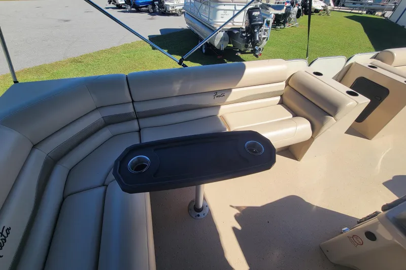 Slide: The Image of 2022 Fiesta 22' Fundeck L Sofa RE Deluxe with beige seating and table. - 12