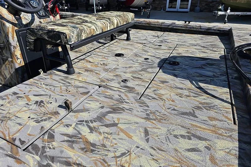 Slide: The Image of 2026 Ranger RB190 boat interior with camouflage seating and deck design. - 10