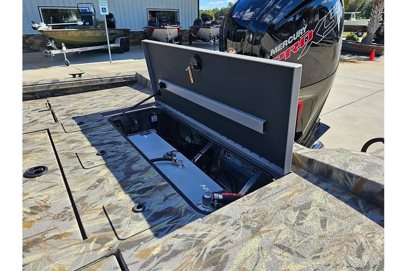 Slide: The Image of 2026 Ranger RB190 boat with open storage compartment and Mercury Pro XS engine. - 11