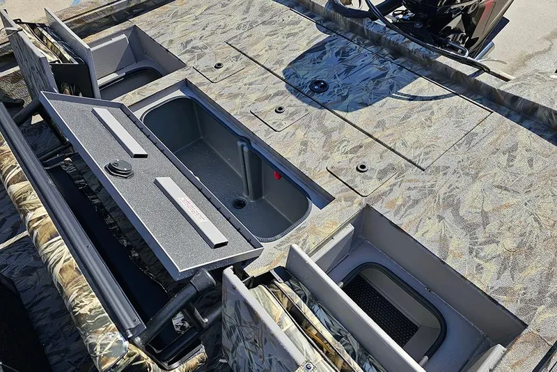 Slide: The Image of 2026 Ranger RB190 boat interior with storage compartments and camouflage design. - 12