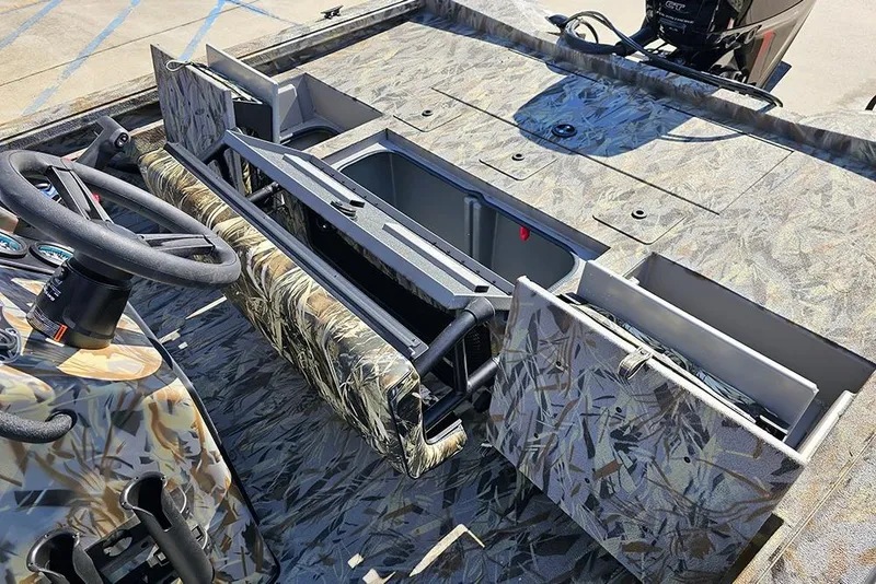 Slide: The Image of 2026 Ranger RB190 boat interior with camo design, featuring steering wheel and storage compartments. - 13