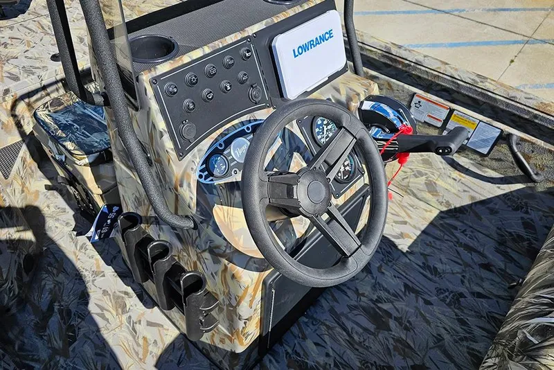 Slide: The Image of 2026 Ranger RB190 boat dashboard with steering wheel and Lowrance electronics. - 15