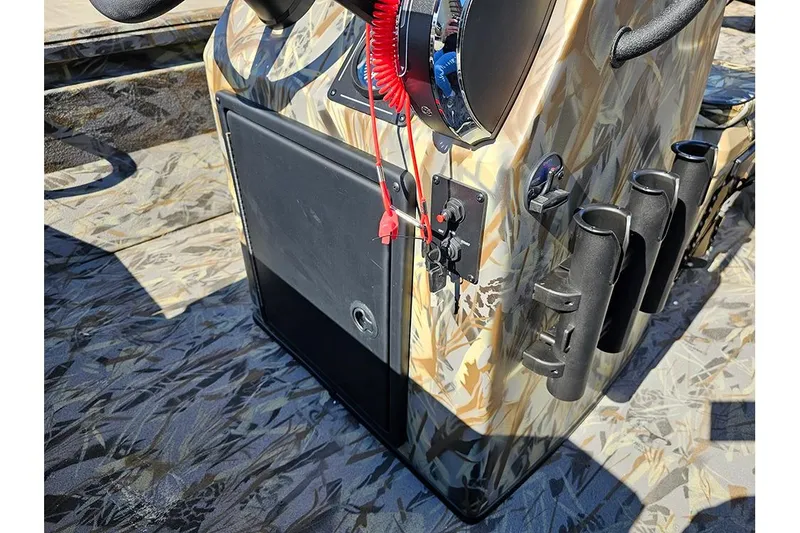 Slide: The Image of 2026 Ranger RB190 boat console with camouflage design and rod holders. - 16