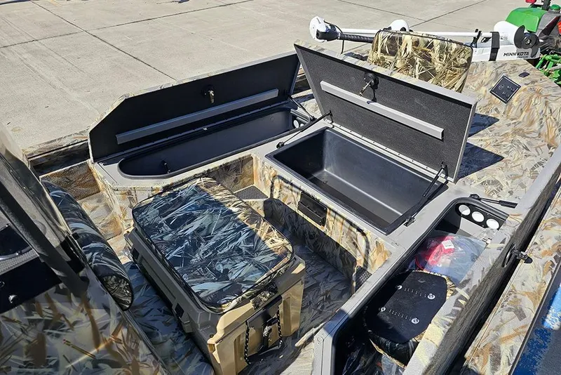 Slide: The Image of 2026 Ranger RB190 boat interior with open storage compartments and camouflage design. - 22