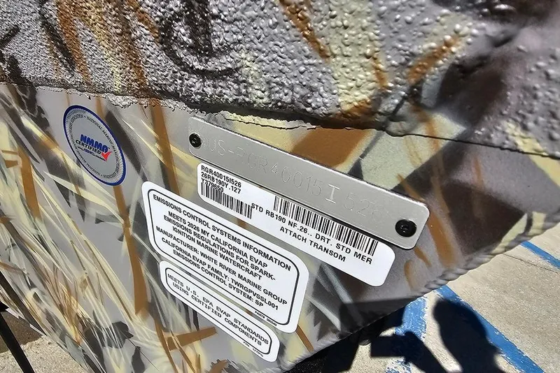 Slide: The Image of 2026 Ranger RB190 boat with emissions control information and certification labels. - 26