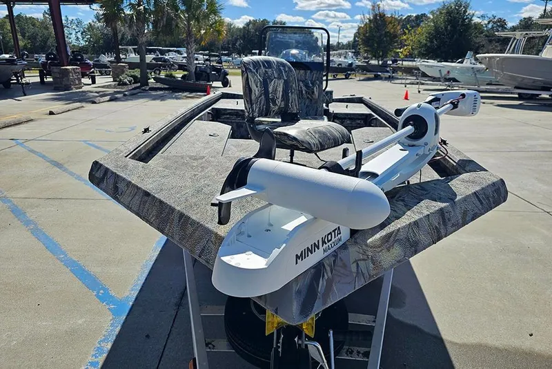 Slide: The Image of 2026 Ranger RB190 boat with Minn Kota trolling motor in a marina setting. - 4