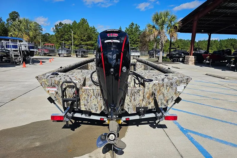Slide: The Image of 2026 Ranger RB190 boat with Mercury outboard motor, parked outdoors on a sunny day. - 8