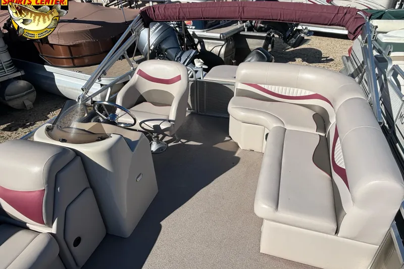 Slide: The Image of 2019 Qwest Edge 816 CR pontoon boat interior with seating and steering console. - 4