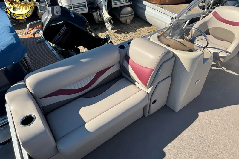 Slide: The Image of 2019 Qwest Edge 816 CR boat interior with seating and steering console. - 8
