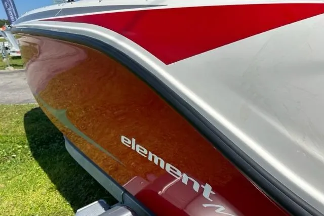 Slide: The Image of 2026 Bayliner M17 boat with red and white design, "element" branding visible. - 4