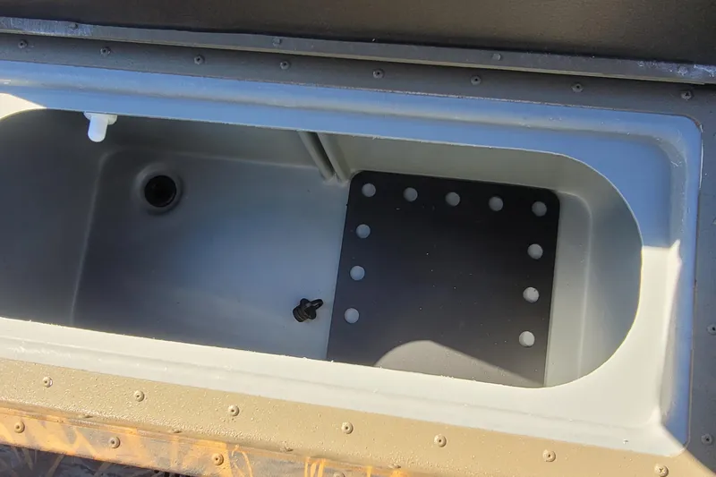 Slide: The Image of Open storage compartment of 2026 G3 Bay 21 GX Tunnel boat. - 16