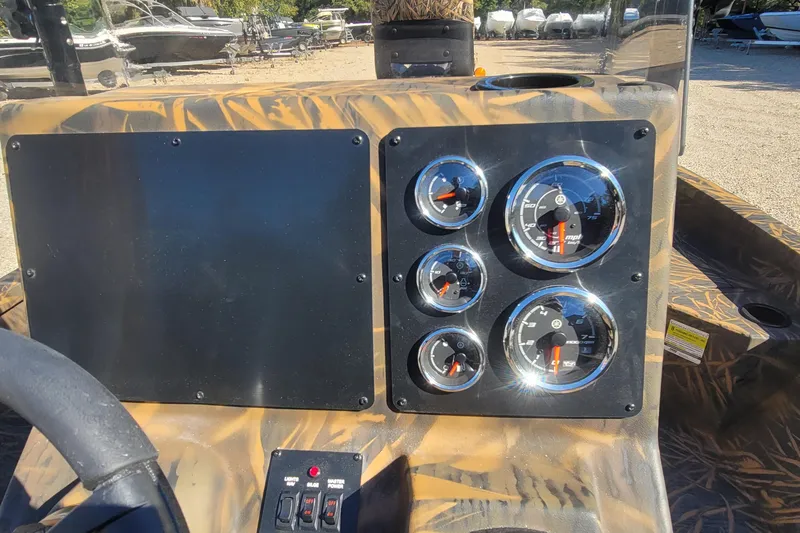 Slide: The Image of Dashboard of 2026 G3 Bay 21 GX Tunnel boat with gauges and controls. - 23