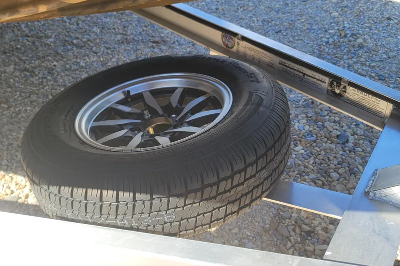 Slide: The Image of Spare tire mounted on a 2026 G3 Bay 21 GX Tunnel boat trailer. - 26