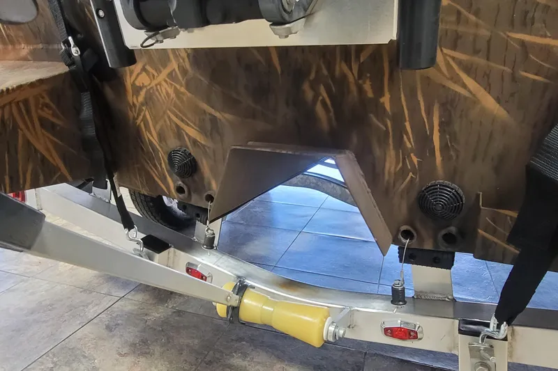 Slide: The Image of 2026 G3 Bay 21 GX Tunnel boat trailer with camouflage design and sturdy construction. - 28