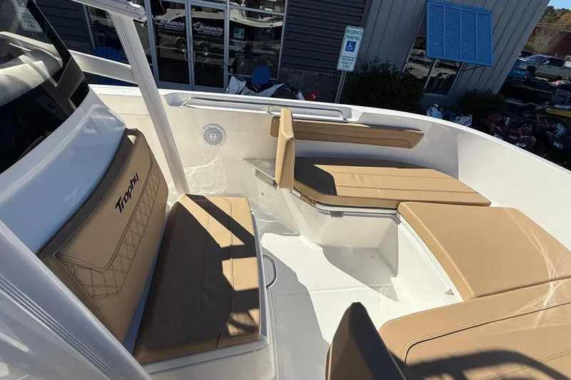Slide: The Image of 2026 Bayliner Trophy T22CC boat interior with tan seating and modern design. - 10
