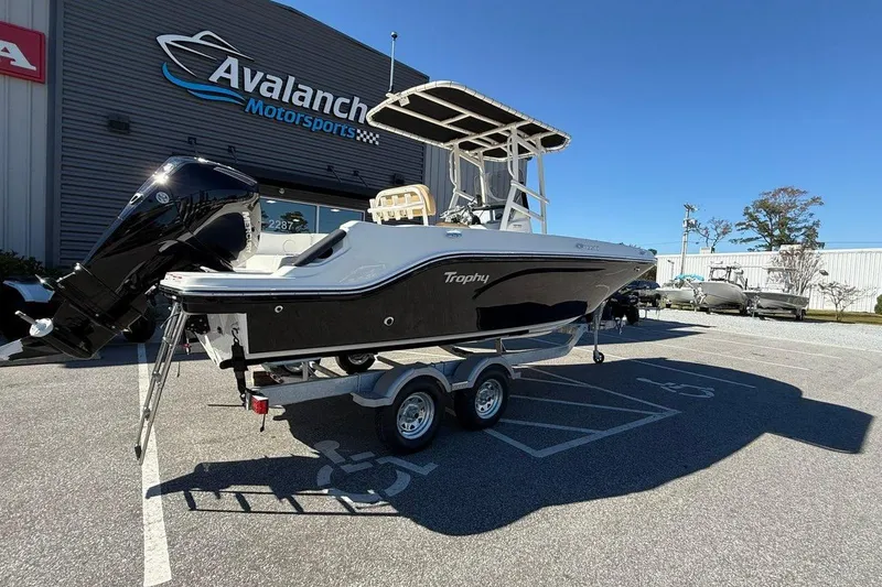 Slide: The Image of 2026 Bayliner Trophy T22CC boat on trailer at Avalanche Motorsports dealership. - 5