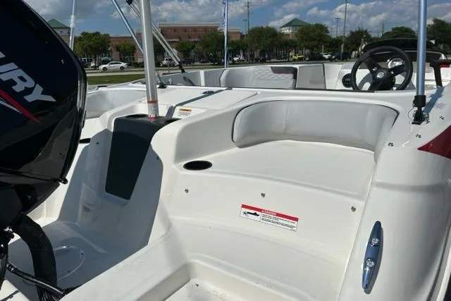 Slide: The Image of 2026 Bayliner M17 boat interior with seating and Mercury engine, showcasing modern design. - 10