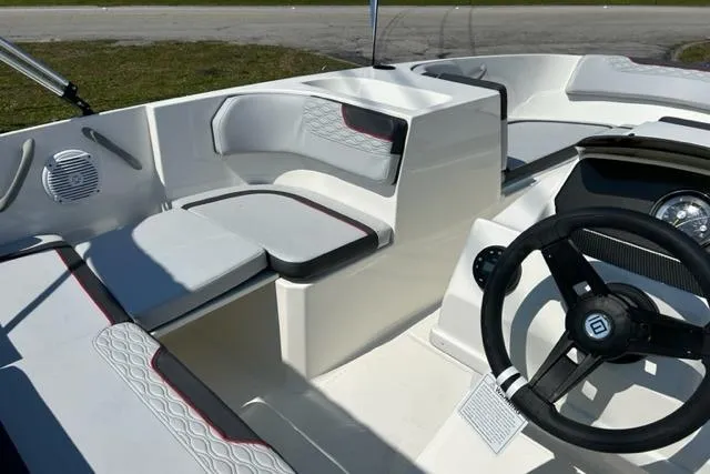 Slide: The Image of 2026 Bayliner M17 boat interior with modern seating and steering wheel design. - 12