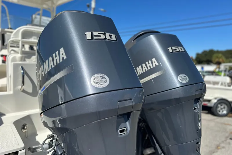 Slide: The Image of Twin Yamaha 150 outboard engines on a 2015 Sailfish 240 CC boat. - 15