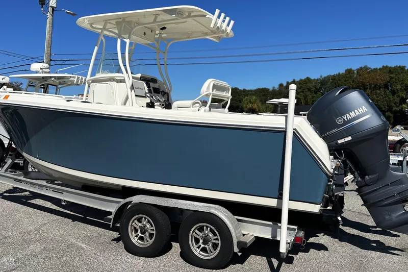Slide: The Image of 2015 Sailfish 240 CC boat on trailer with Yamaha outboard motor. - 19