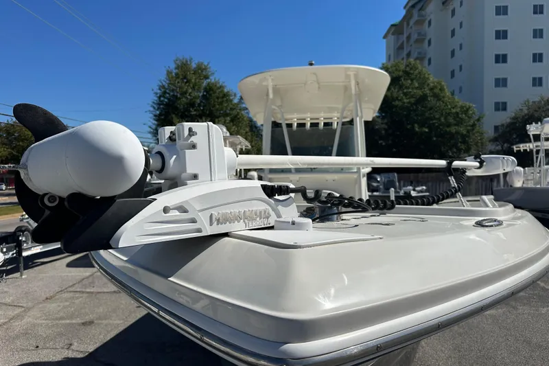 Slide: The Image of 2015 Sailfish 240 CC boat with Minn Kota Terrova motor, docked near buildings. - 5