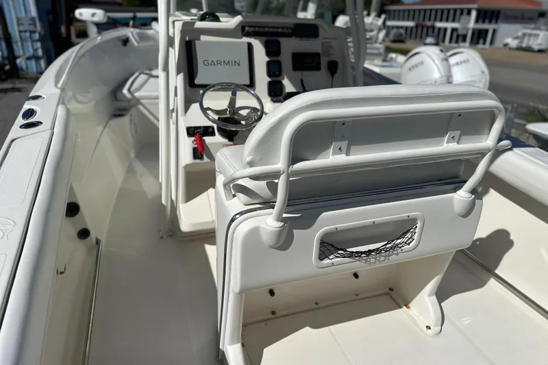 Slide: The Image of 2015 Sailfish 240 CC boat interior with Garmin navigation system. - 8