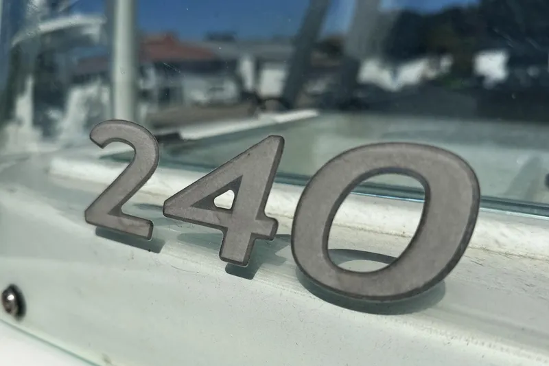 Slide: The Image of Close-up of Sailfish 240 CC boat emblem, 2015 model, in sunlight. - 9