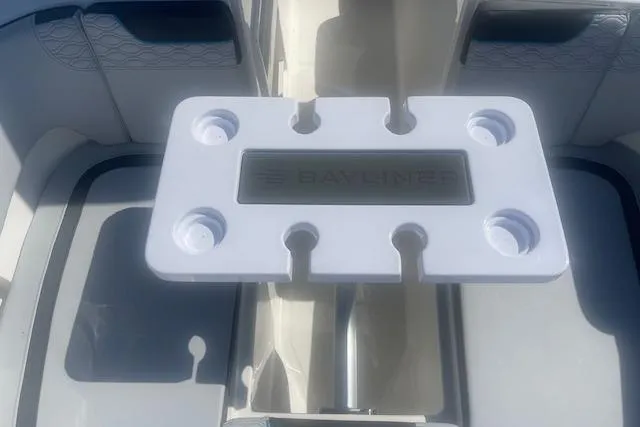 Slide: The Image of 2026 Bayliner M17 boat interior with cup holders and seating area. - 11