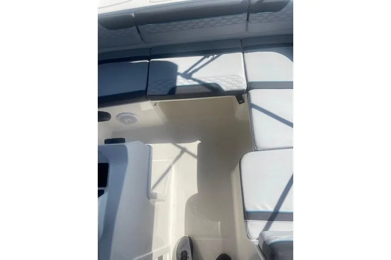 Slide: The Image of Interior view of 2026 Bayliner M17 boat with cushioned seating. - 3