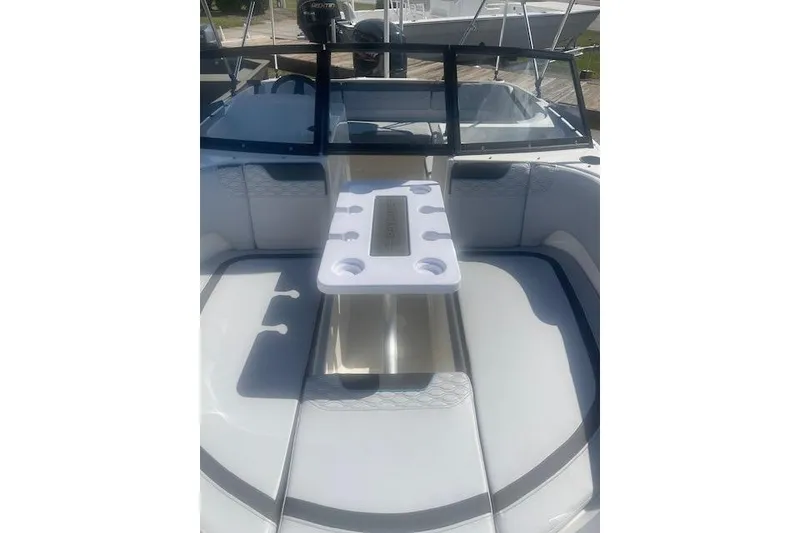 Slide: The Image of 2026 Bayliner M17 boat interior with seating and table setup. - 5
