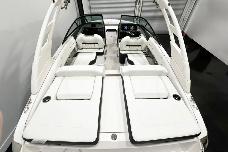 Slide: The Image of 2025 Regal LS2 boat interior with luxurious white seating and modern dashboard design. - 4