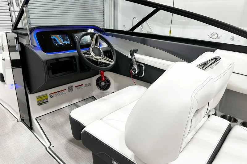 Slide: The Image of 2025 Regal LS2 boat interior with modern dashboard and white leather seating. - 7