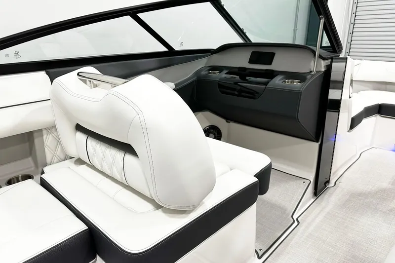Slide: The Image of 2025 Regal LS2 boat interior with white leather seating and modern dashboard design. - 8