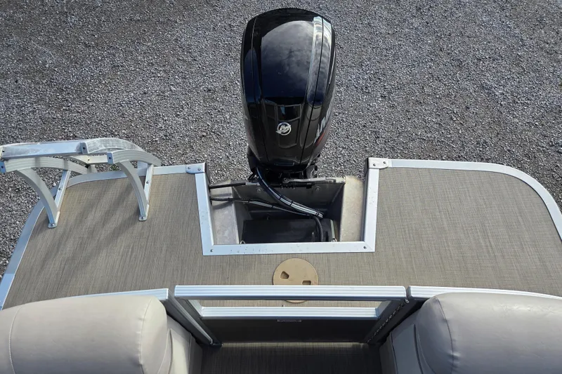 Slide: The Image of 2017 Bennington 22 SSRX boat with outboard motor and spacious deck. - 11