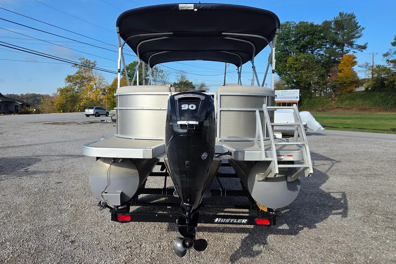 Slide: The Image of 2017 Bennington 22 SSRX pontoon boat with Mercury 90 engine on trailer. - 3