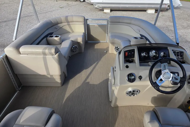 Slide: The Image of 2017 Bennington 22 SSRX pontoon boat interior with plush seating and modern dashboard. - 6