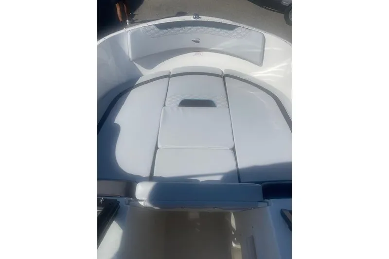 Slide: The Image of 2026 Bayliner M17 boat interior with cushioned seating and sleek design. - 14
