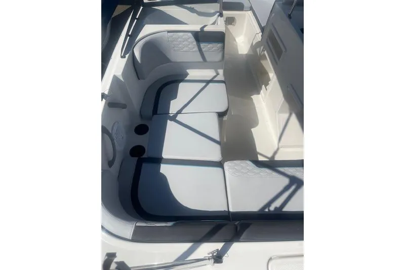 Slide: The Image of 2026 Bayliner M17 boat interior with cushioned seating and modern design. - 16