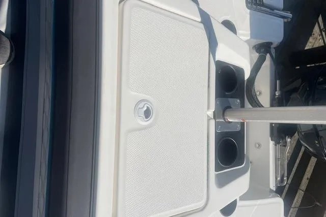 Slide: The Image of 2026 Bayliner M17 boat interior with cup holders and storage compartment. - 20