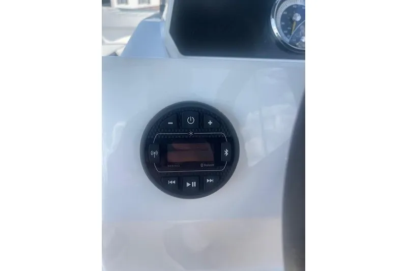 Slide: The Image of 2026 Bayliner M17 boat dashboard with Bluetooth audio control panel. - 10