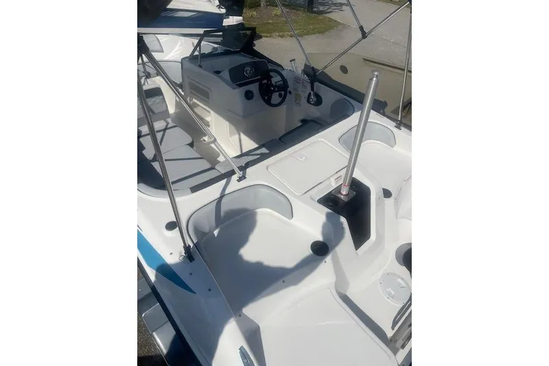 Slide: The Image of 2026 Bayliner M17 boat interior with steering console and seating area. - 15