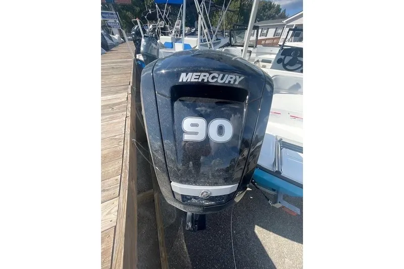 Slide: The Image of 2026 Bayliner M17 with Mercury 90 outboard engine at dockside. - 18