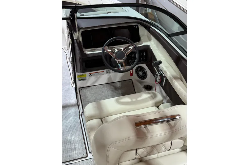Slide: The Image of 2026 Regal LS2 boat interior with steering wheel and beige seating. - 9