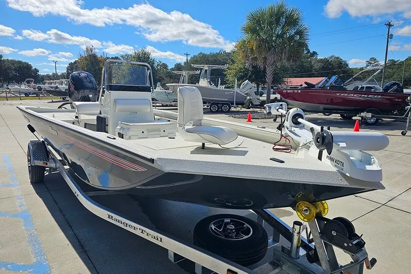 Slide: The Image of 2026 Ranger RB190 boat on trailer in sunny outdoor showroom. - 5