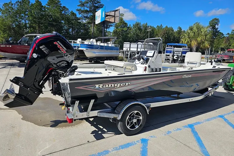 Slide: The Image of 2026 Ranger RB190 boat with Mercury engine on trailer, parked outdoors. - 7