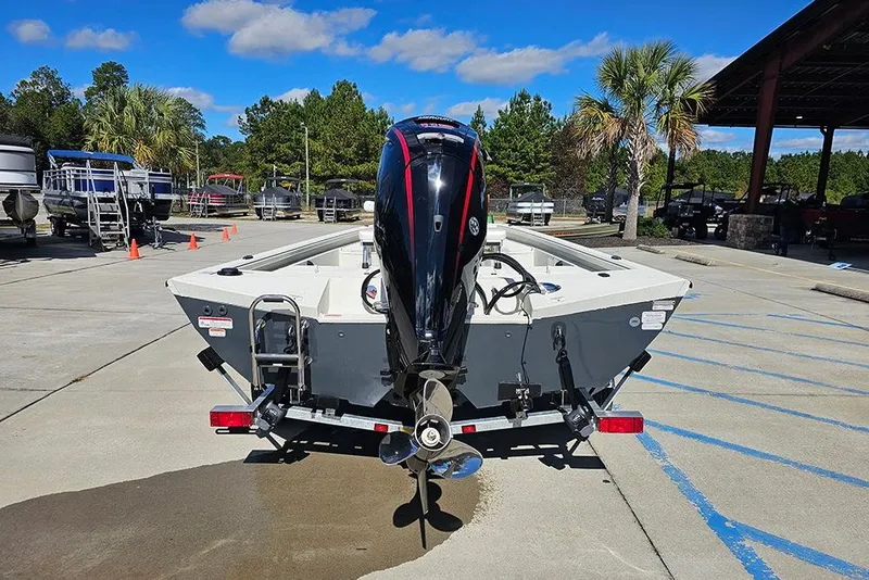 Slide: The Image of 2026 Ranger RB190 boat with outboard motor in a marina setting. - 8